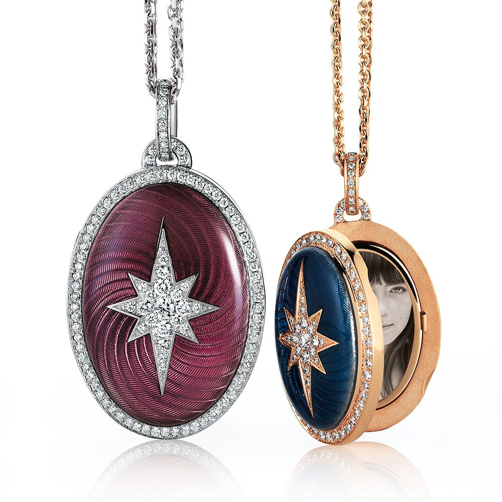 Two lockets with diamond star and halo, pink and blue vitrous enamel. One locket is open an features a miniature portrait of a young lady