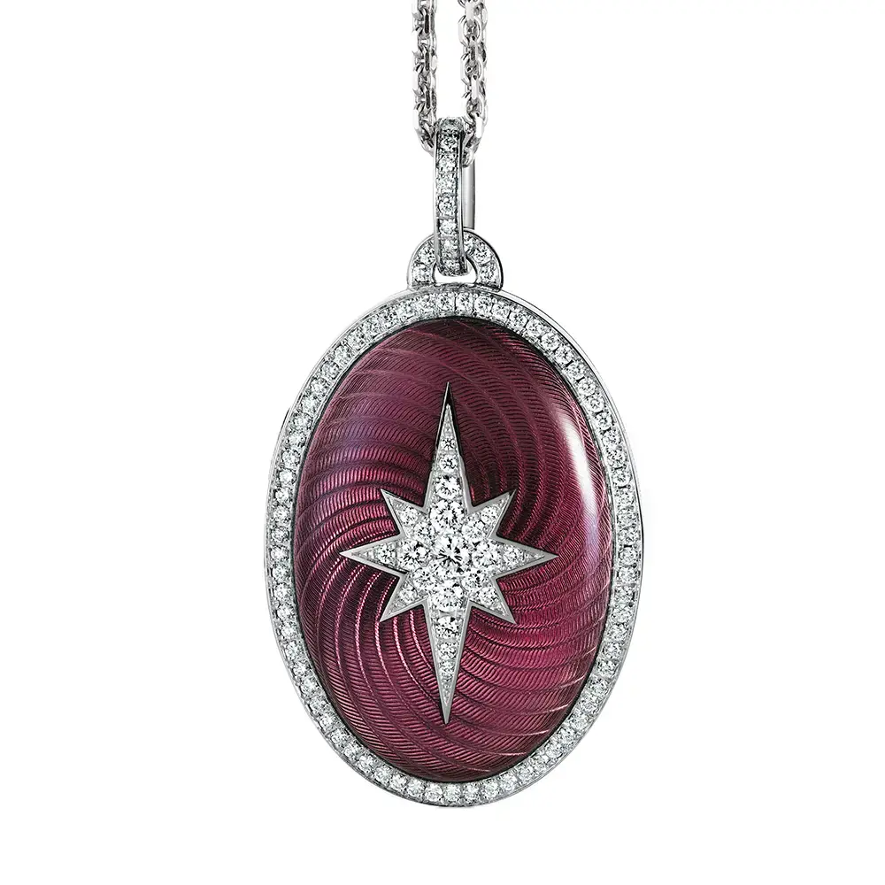 Medaillon aus Weißgold in rosa Farbe und ovaler Form verziert mit einem Kranz aus Brillanten und einem Brillanten-Stern