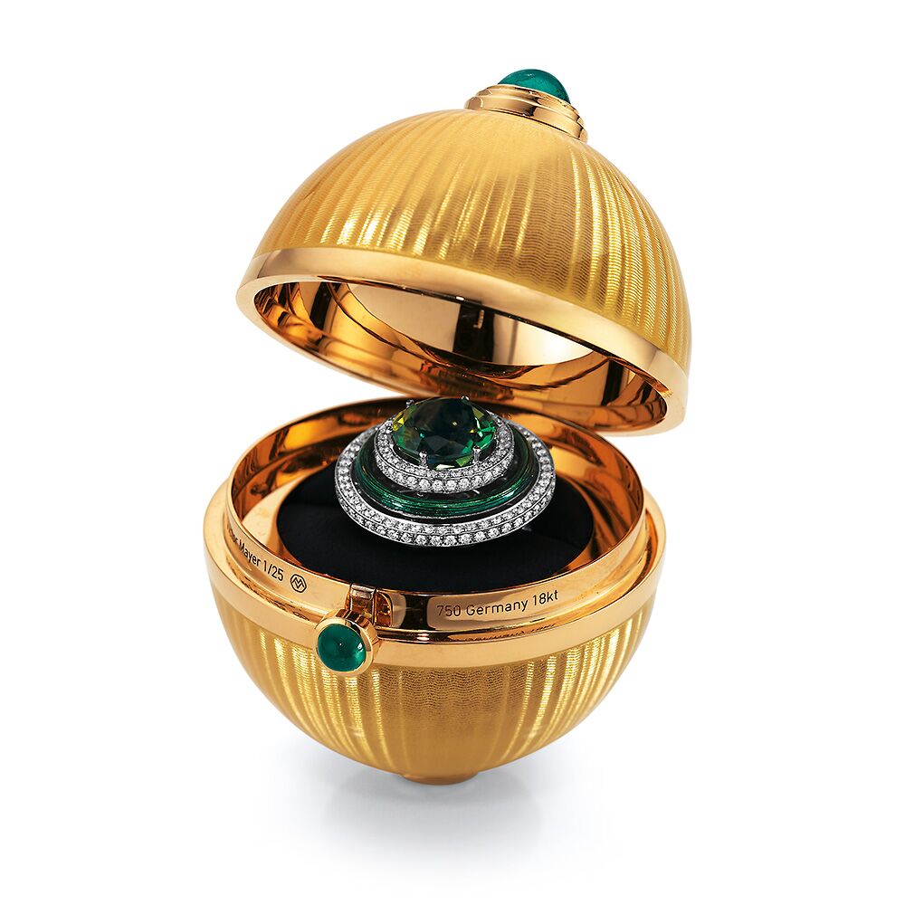 Golden object to open with fondant enamelled guilloche, emeralds, Cocolong foot and surprise inside.