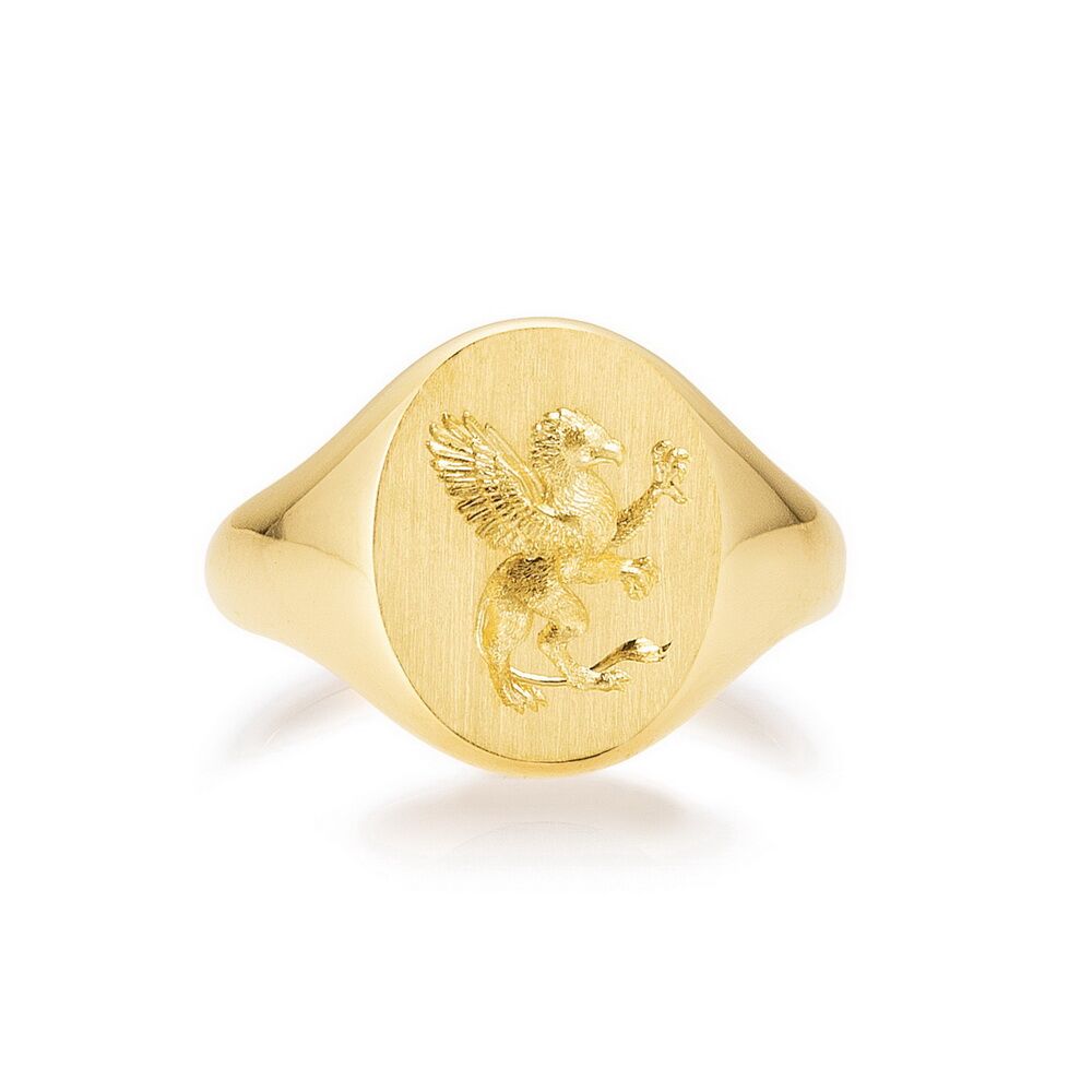Oval signet ring in 18k yellow gold with hand engraving of a griffin