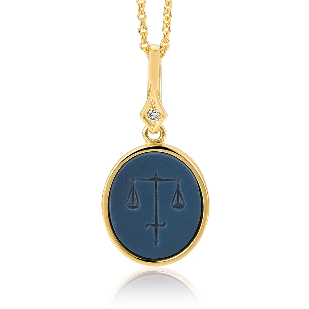 Oval pendant necklace, yellow gold, blue gemstone,sword and a scale, diamond.