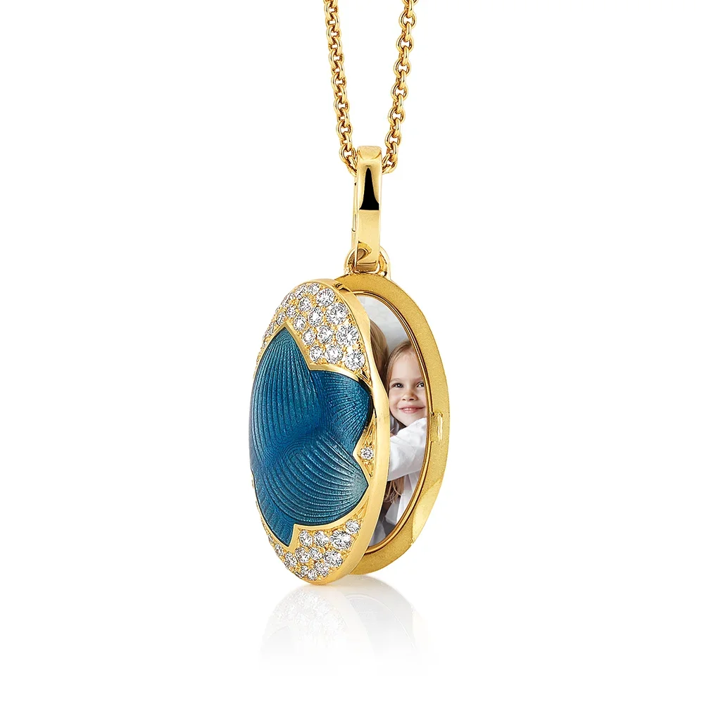 Yellow gold Locket coloured blue and decorated with diamonds