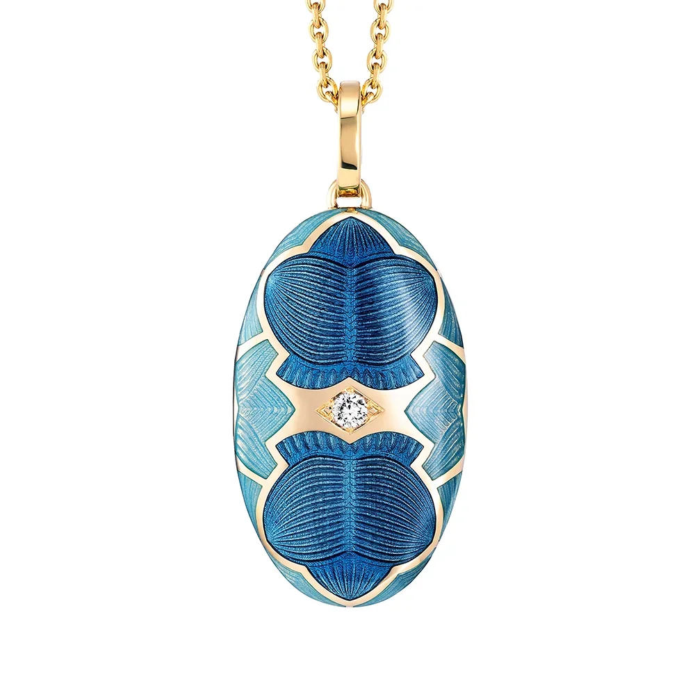 Medaillon aus Gelbgold blau gefärbt und verziert mit einem Brillanten