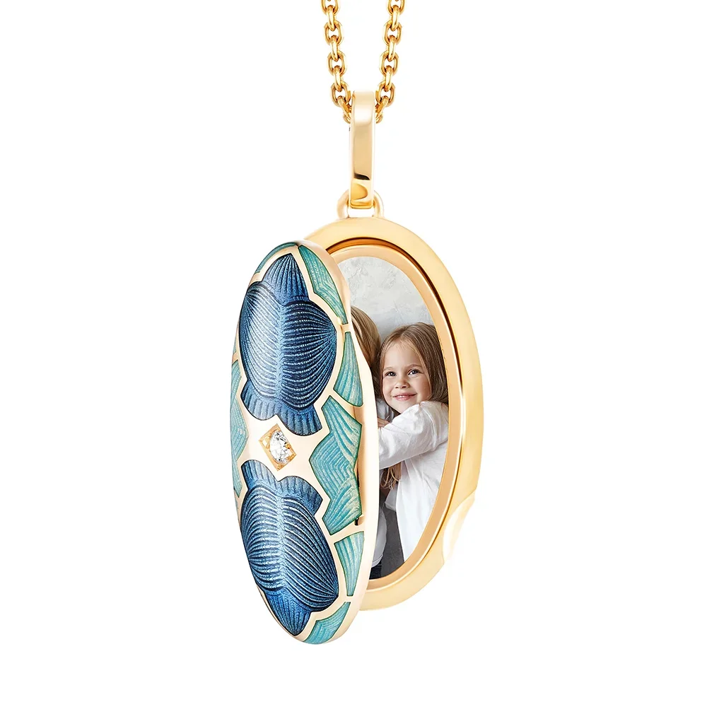 Medaillon aus Gelbgold blau gefärbt und verziert mit einem Brillanten
