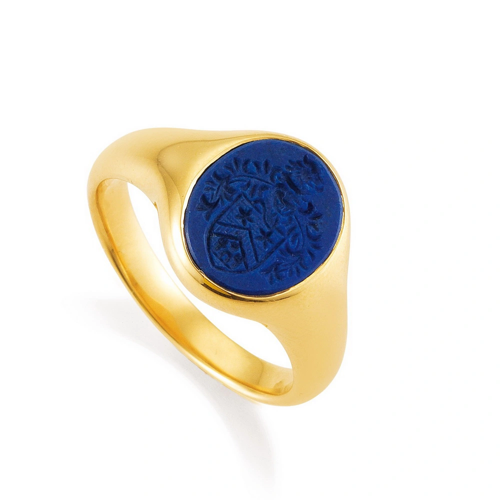 Signet ring yellow gold with oval blue gemstone and coat of arms engraving