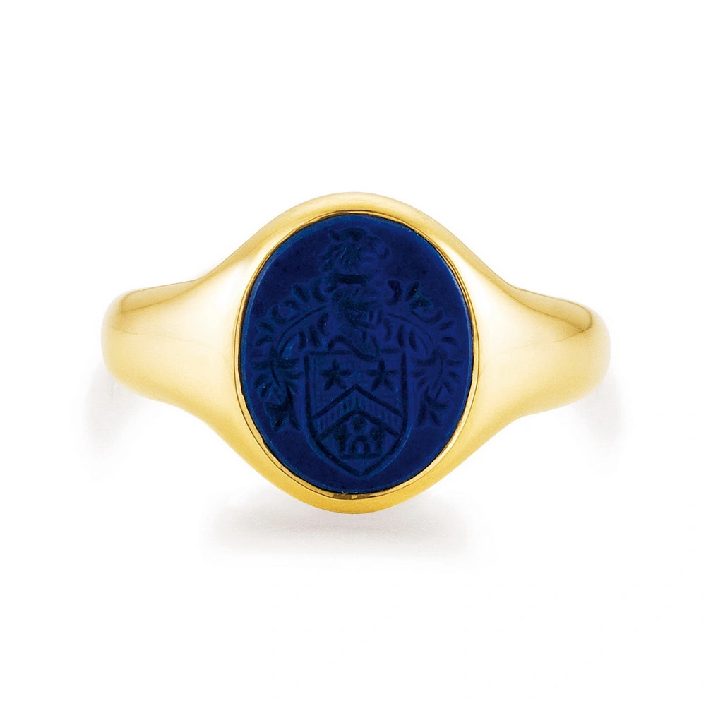 Signet ring yellow gold with oval blue gemstone and coat of arms engraving
