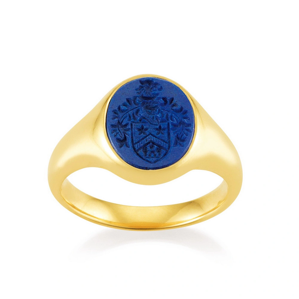 Signet ring yellow gold with oval blue gemstone and coat of arms engraving
