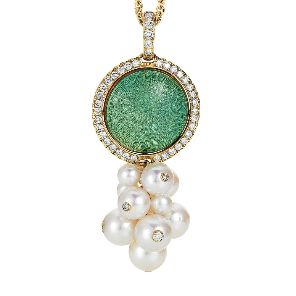 Swivel pendant Candy in yellow gold with a round 20.2 mm head, domed enamel surface in turquoise and blue over windmill guilloché, surrounded by 48 diamonds and decorated with a cluster of 9 Akoya cultured pearls, each set with a diamond.