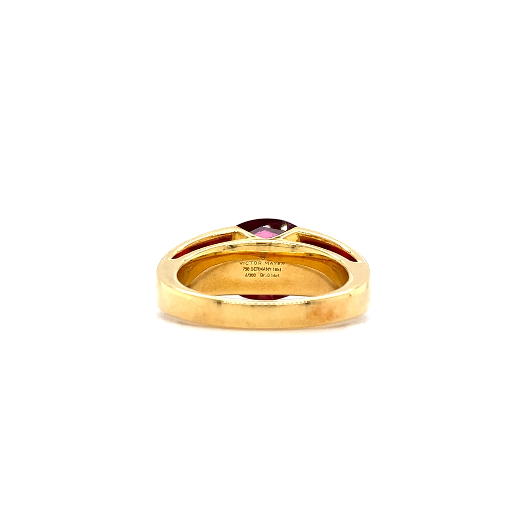 Ring aus Gelbgold mit weißer Farbe verziert mit Brillanten und einem roten Edelstein