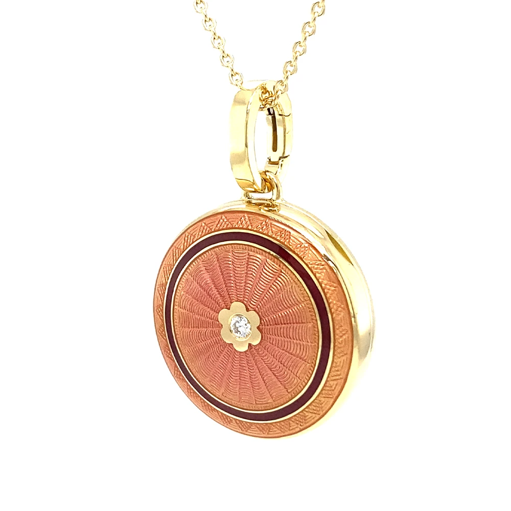 Round locket necklace in yellow gold, lacquered pink and set with a diamond