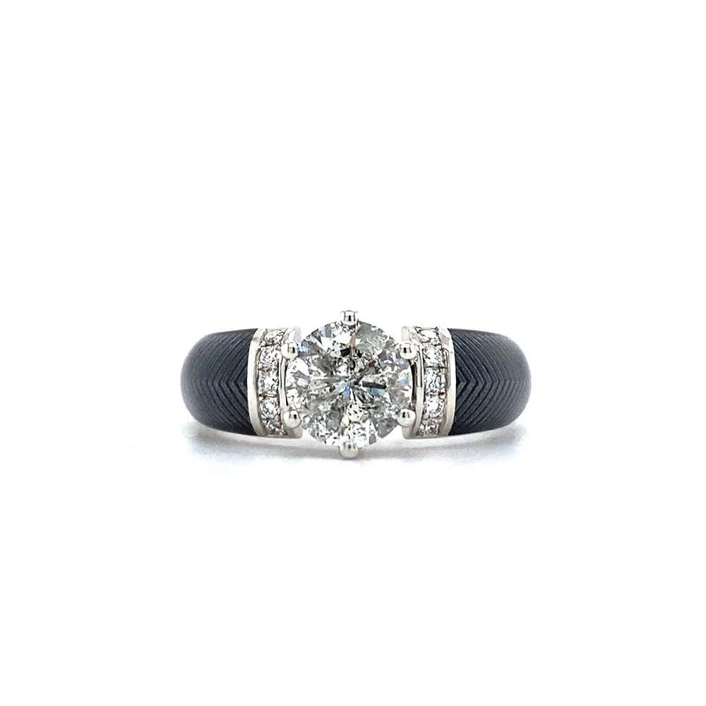 Golden ring with a white centre stone and two rows of small diamonds next to it. The ring shoulders are coloured grey.