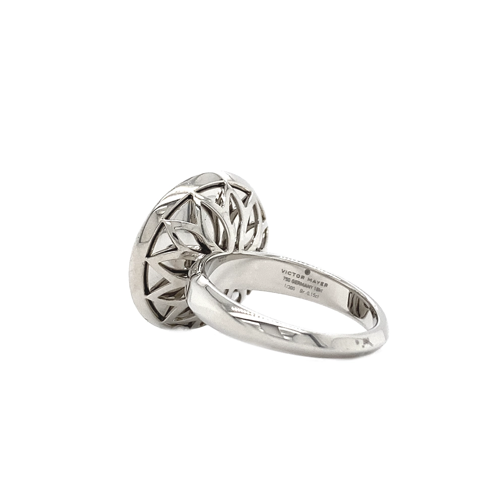 Ring in white gold with a round ring head. The ring head is concave and covered with translucent purple vitreous enamel, beneath which a fine windmill guilloché pattern is visible. A single small diamond is set at the centre of the enamel surface as a subtle focal point. The design appears calm, geometric, and balanced.