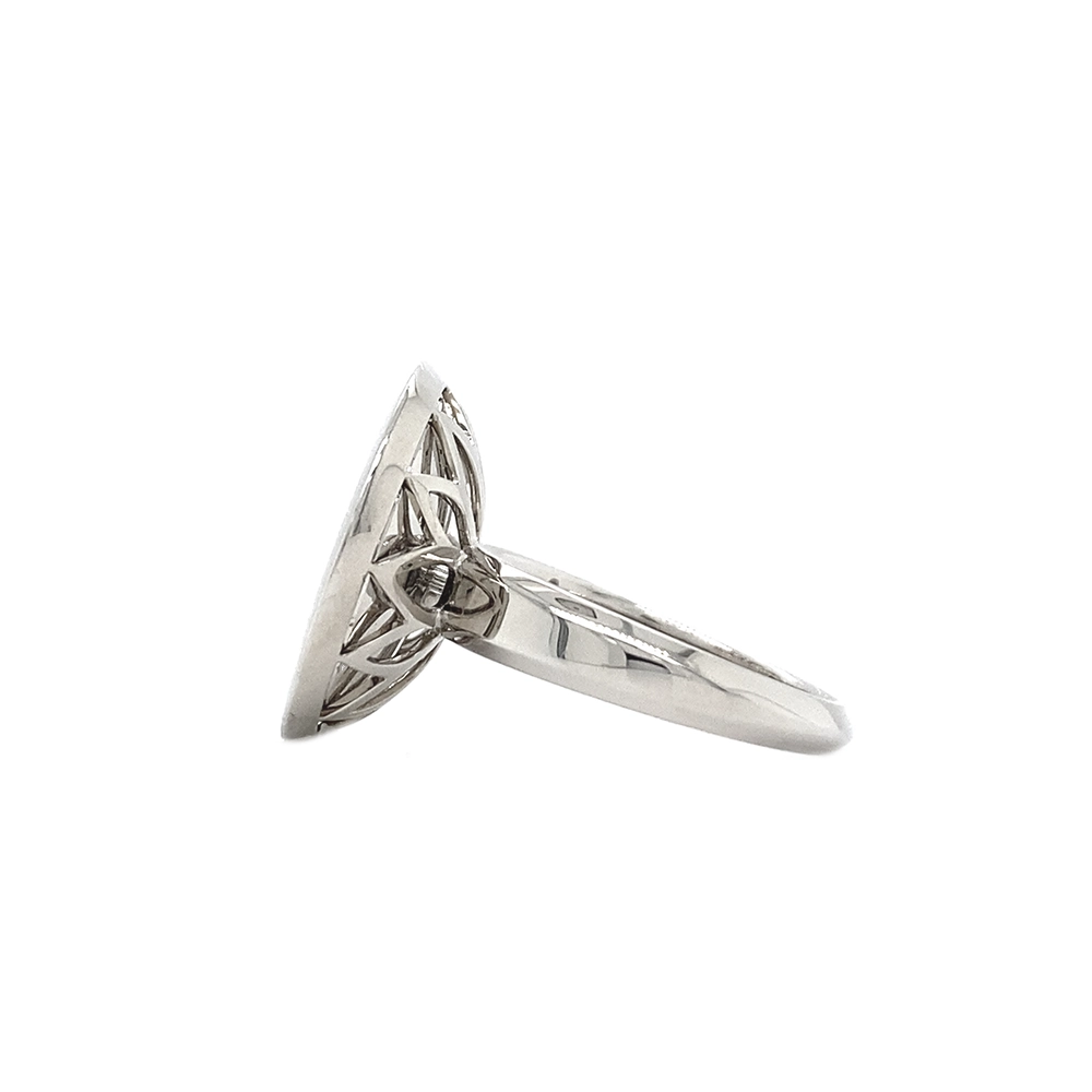 Ring in white gold with a round ring head. The ring head is concave and covered with translucent purple vitreous enamel, beneath which a fine windmill guilloché pattern is visible. A single small diamond is set at the centre of the enamel surface as a subtle focal point. The design appears calm, geometric, and balanced.