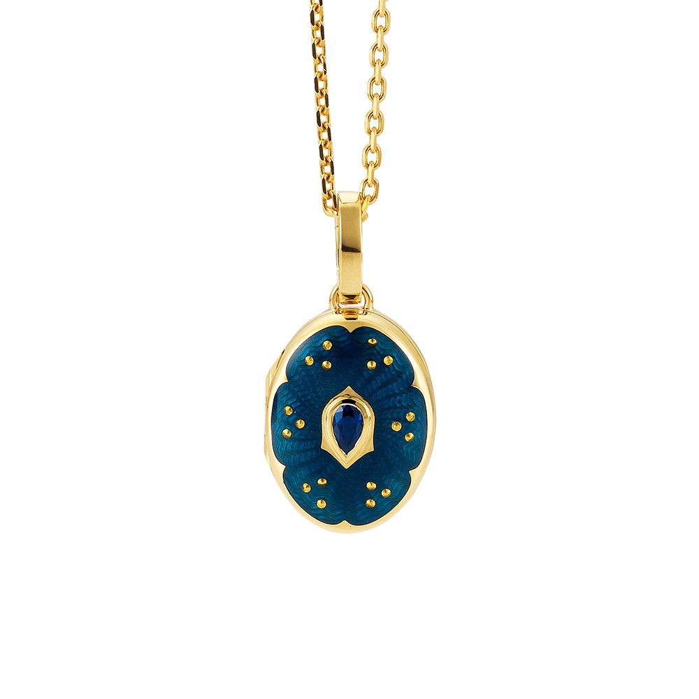 Ovaler Medaillon-Anhänger aus Gelbgold, blau lackiert mit einer vielzahl kleiner goldener Punkte und mit einem tropfenförmigen blauen Edelstein in der Mitte.
