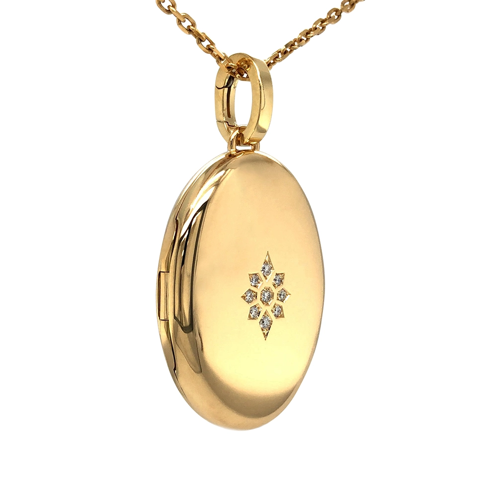 Ovaler Medaillon-Anhänger in Gelbgold mit sternförmig gefassten Brillanten.