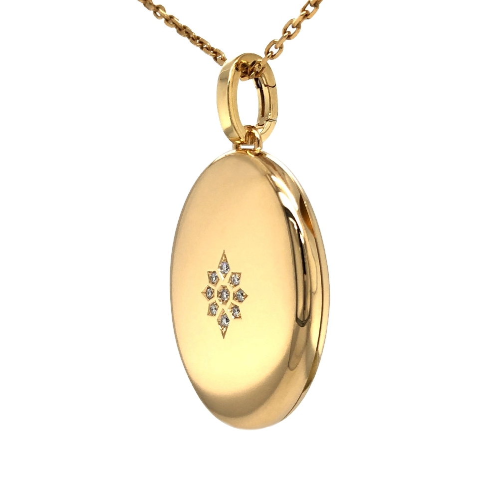 Ovaler Medaillon-Anhänger in Gelbgold mit sternförmig gefassten Brillanten.