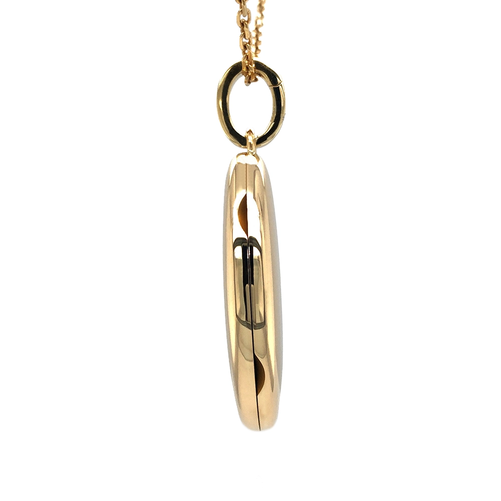 Ovaler Medaillon-Anhänger in Gelbgold mit sternförmig gefassten Brillanten.